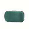 Emerald green satin back panel of a dual-design luxury evening clutch with silver metal clasp frame.