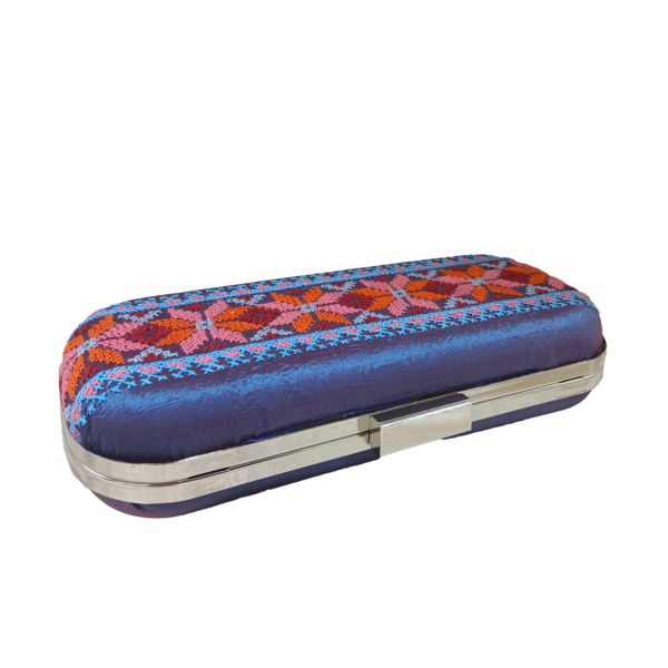 Top view of a purple embroidered clutch bag with a secure silver-toned metal clasp closure.
